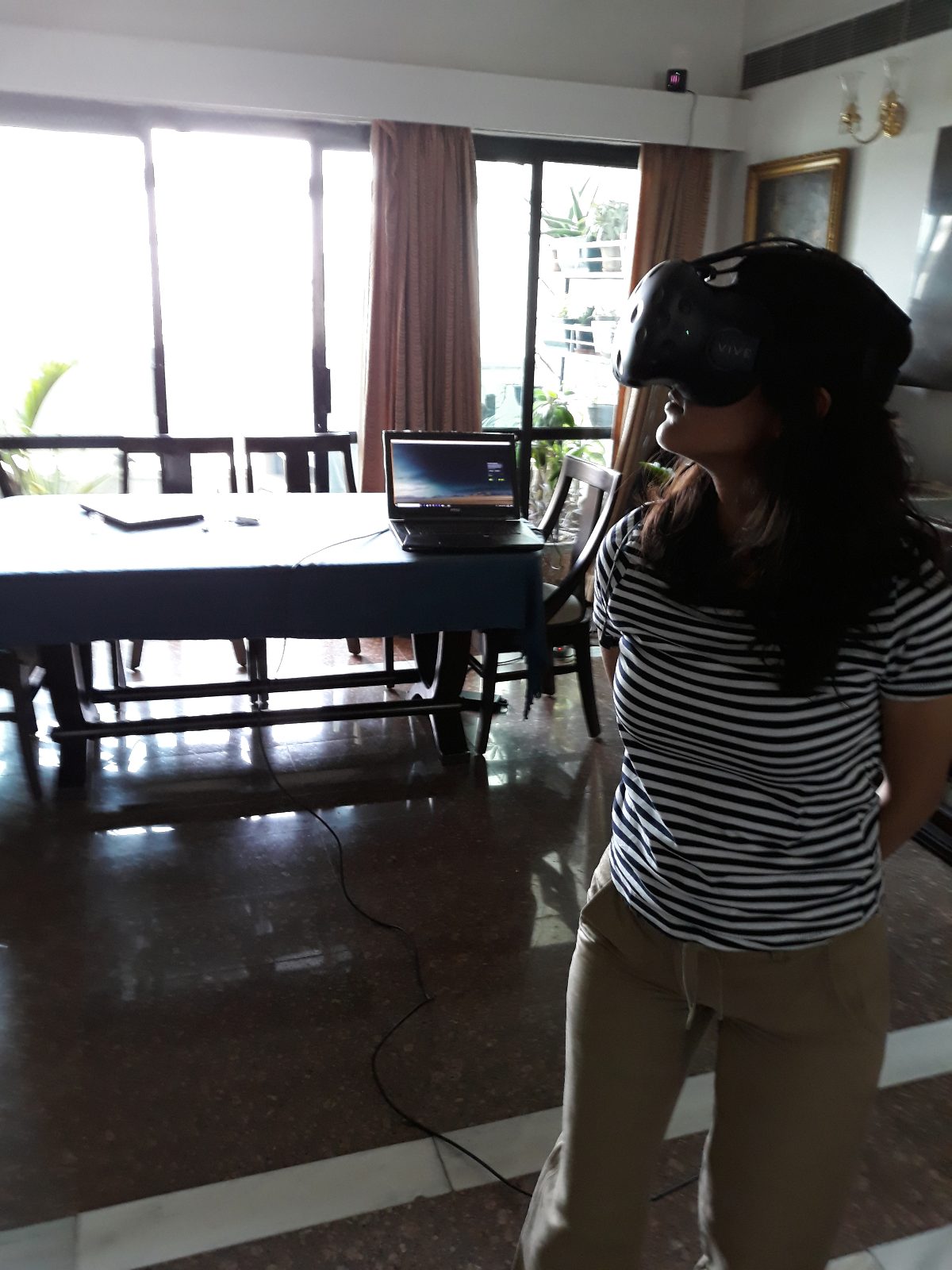 Shreenu Mukherjee evaluates a VR 3D walkthrough for a design project client.