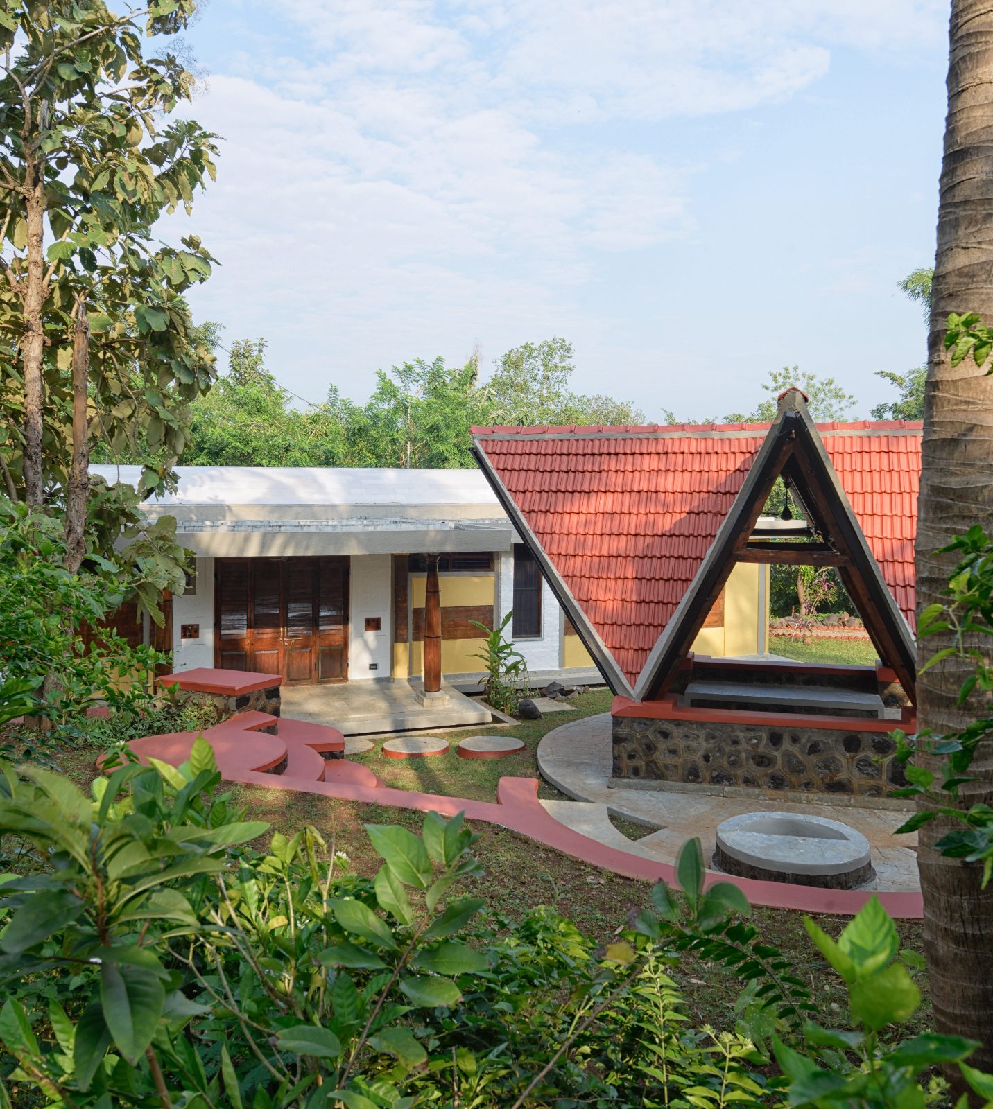 Rammed earth farm house, Thane, Mumbai: A-frame gazebo garden path, architectural photograph.