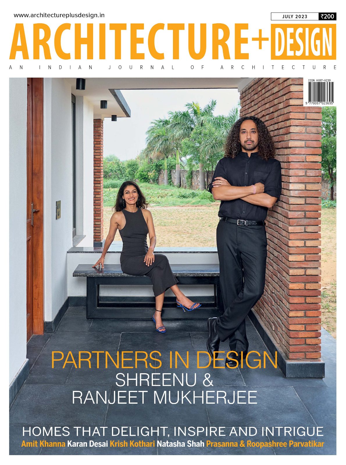 Architecture+Design July 2023 cover, Partners in Design: Shreenu and Ranjeet Mukherjee on a brick and stone verandah.