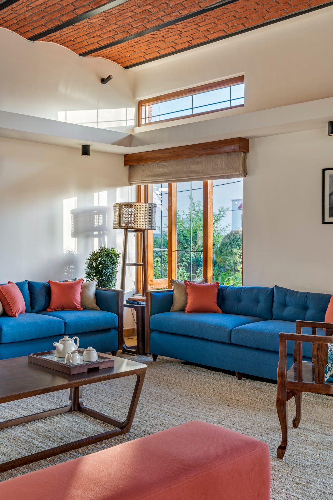 entheogenic-house-jammu-living-room-blue-sofas-double-height-interior-design-photography-04