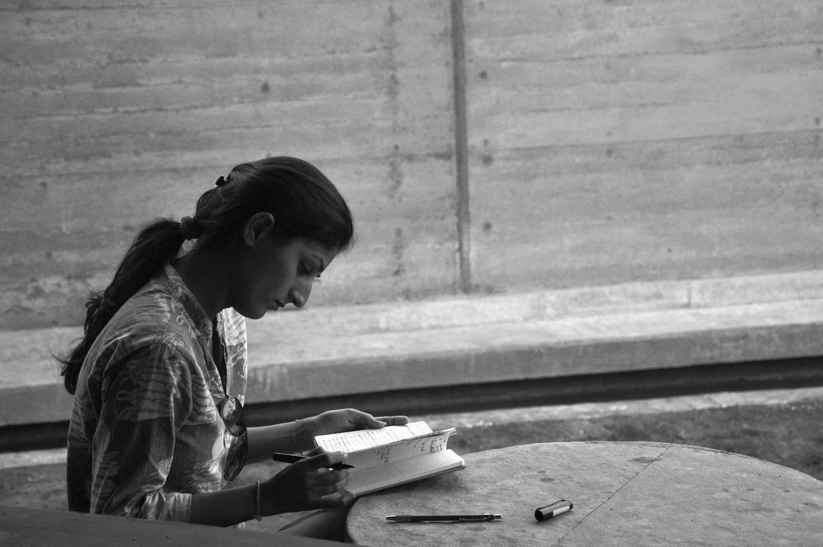 SHreenu Mukherjee takes notes on site progress for a farmhouse project